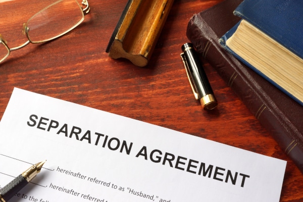 Separation Agreement document sitting on a wooden table