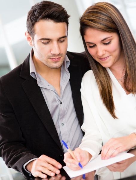Young couple signing a Power of Attorney