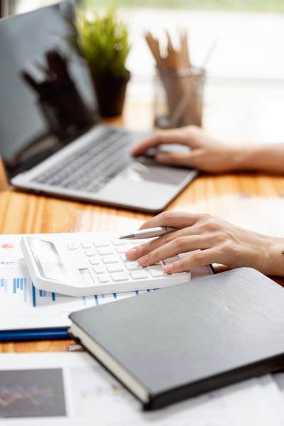 Woman carring out her calculations for commercial re-financing