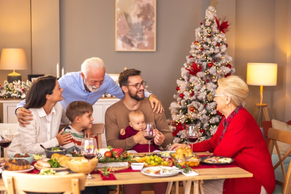 Family gather round the dining table for Christmas Dinner and discuss Wills and Powers of Attorney in Scotland