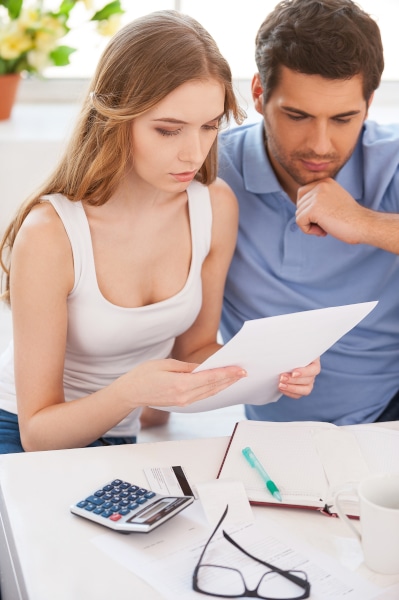 Couple reviewing a cohabitation agreement with a solicitor in Scotland