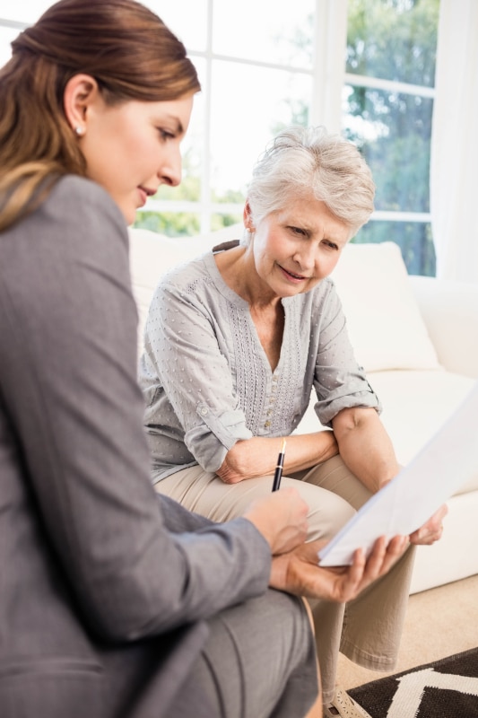 Solicitor meeting with clients about making a Will and Power of Attorney at Pomphreys in Wishaw