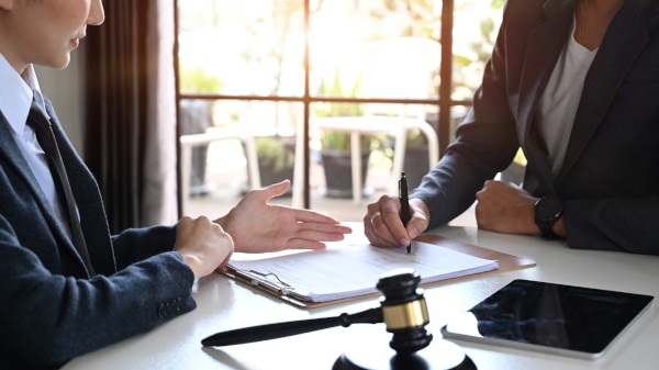 Solicitor discussing employment tribunal deadlines with a client