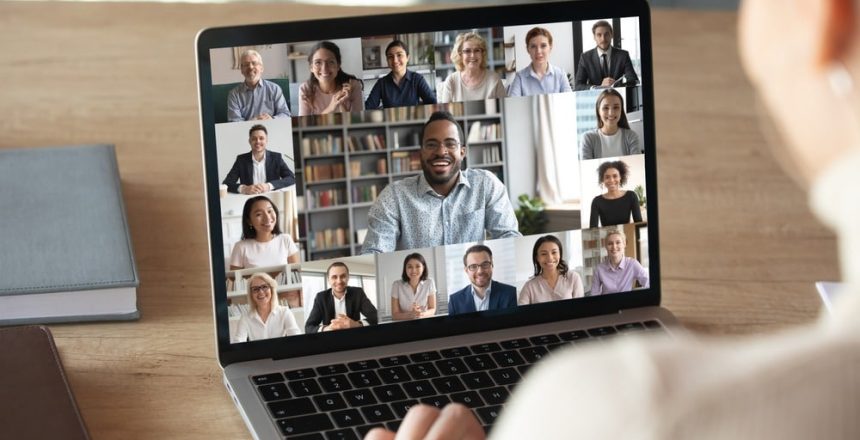 Back,View,Of,Female,Employee,Speak,Talk,On,Video,Call
